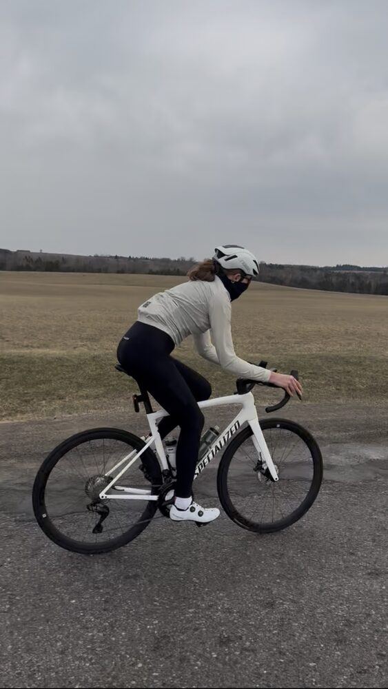 Rider climbing a farm road on the Brooklin to Port Perry loop