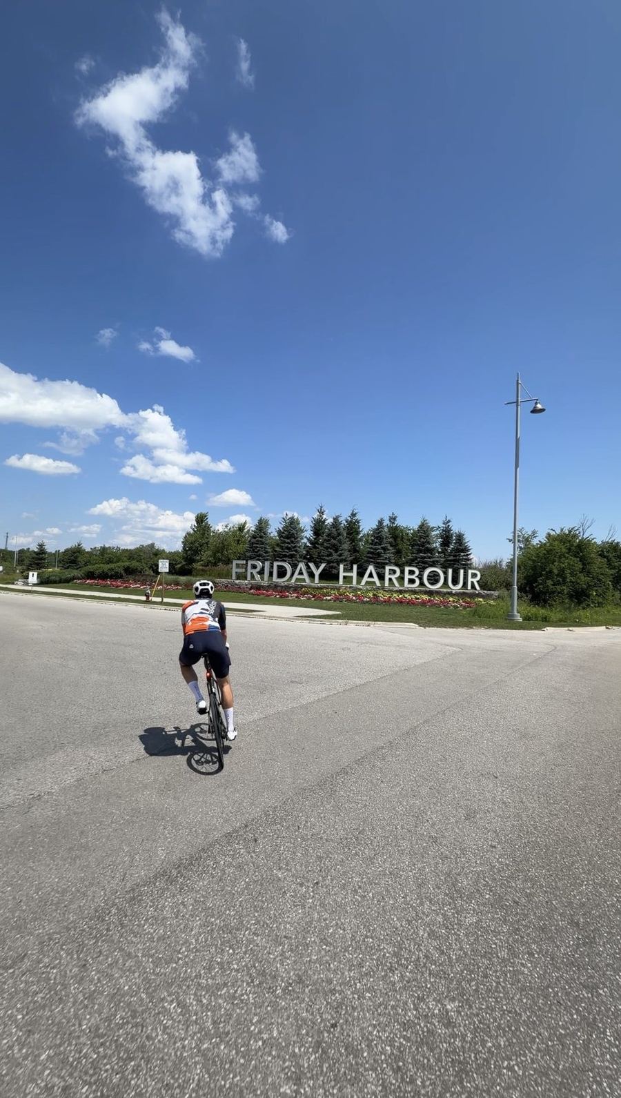 Riding toward the Friday Harbour sign on the approach to the resort