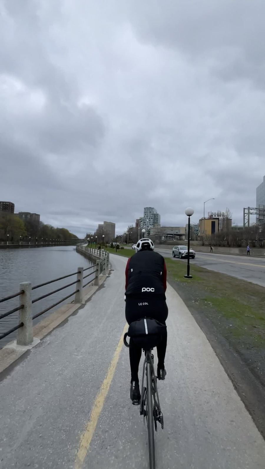 Riding the Rideau Canal pathway with the downtown Ottawa skyline ahead